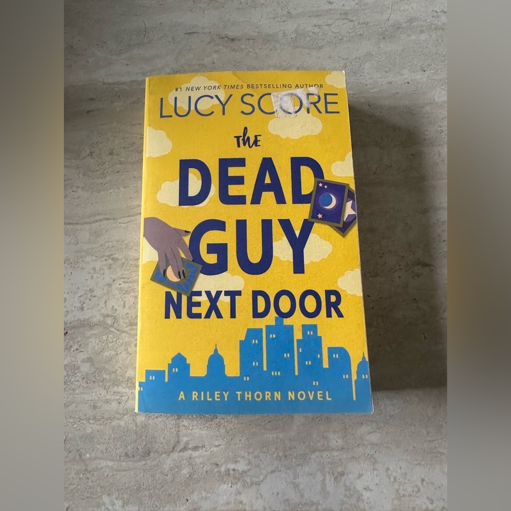 The Dead Guy Next Door- Lucy Score-paperback book